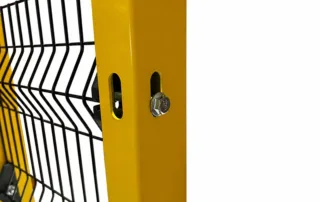 Construction fence style industrial safety fence panel clamped to yellow steel post with bolt-mounted connector