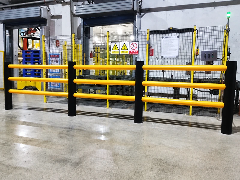 ARMORFLEX Barrier factory-installed steel safety barrier with yellow tubular rails and black posts, guarding machinery access
