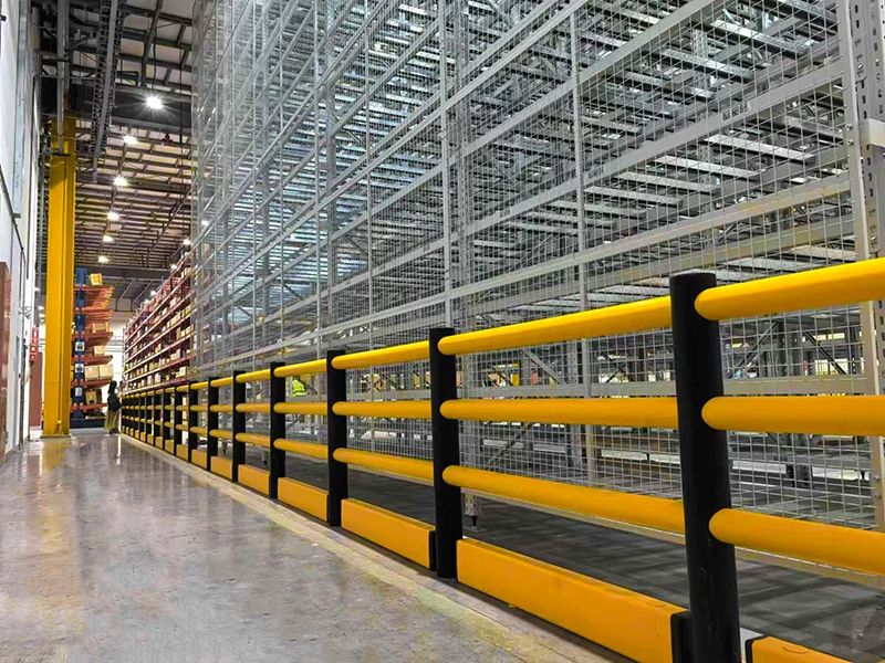 Self-Rebounding Barrier close to the impact zone, showing floor-mounted warehouse safety barrier with yellow rails and black posts