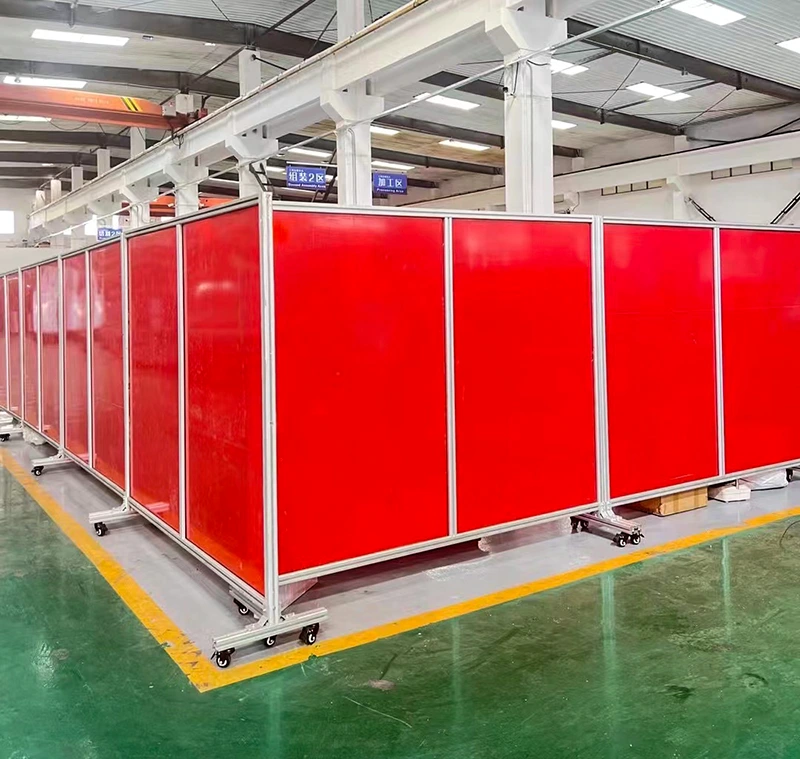 Mobile Alfence safety guarding system with aluminum frames, caster wheels, and modular barrier panels for plant reconfiguration