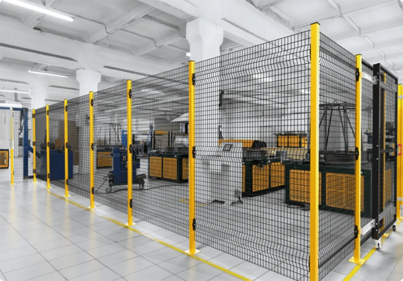 Safety fence industrial factory enclosure with yellow steel posts and modular welded mesh panels around automation