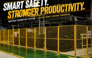 Real factory photo of yellow machine safety fencing with welded mesh perimeter guarding panels