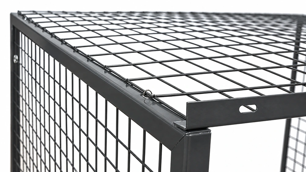 Close-up of a wire mesh cage top panel secured to the steel frame with spiral fasteners and slotted holes.